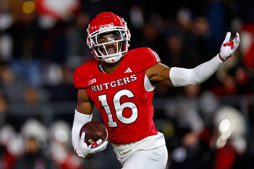 Defensive back Max Melton #16 of the Rutgers Scarlet Knights celebrates his interception