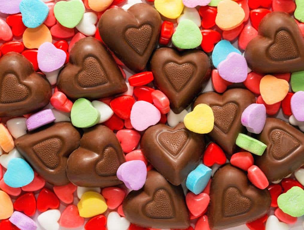 Pile of assorted chocolate and sugar heart shaped Valentine's Day candy