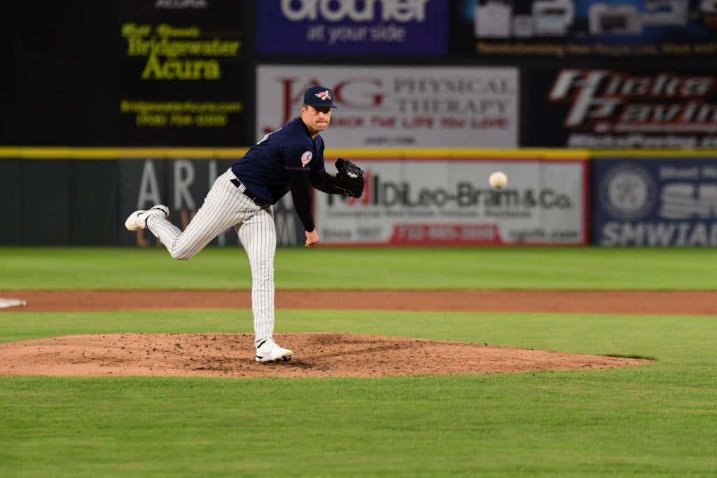 Bailey Dees tosses a pitch from the mound.