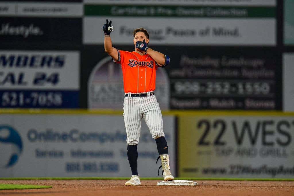 Rafael Flores celebrates a RBI double.