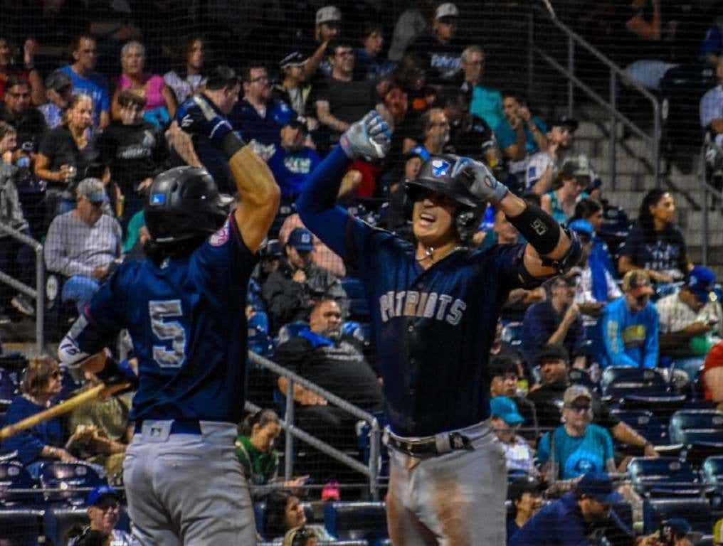 Rafael Flores celebrates his home run.