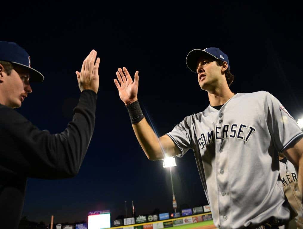 Spencer Jones high fives teammates