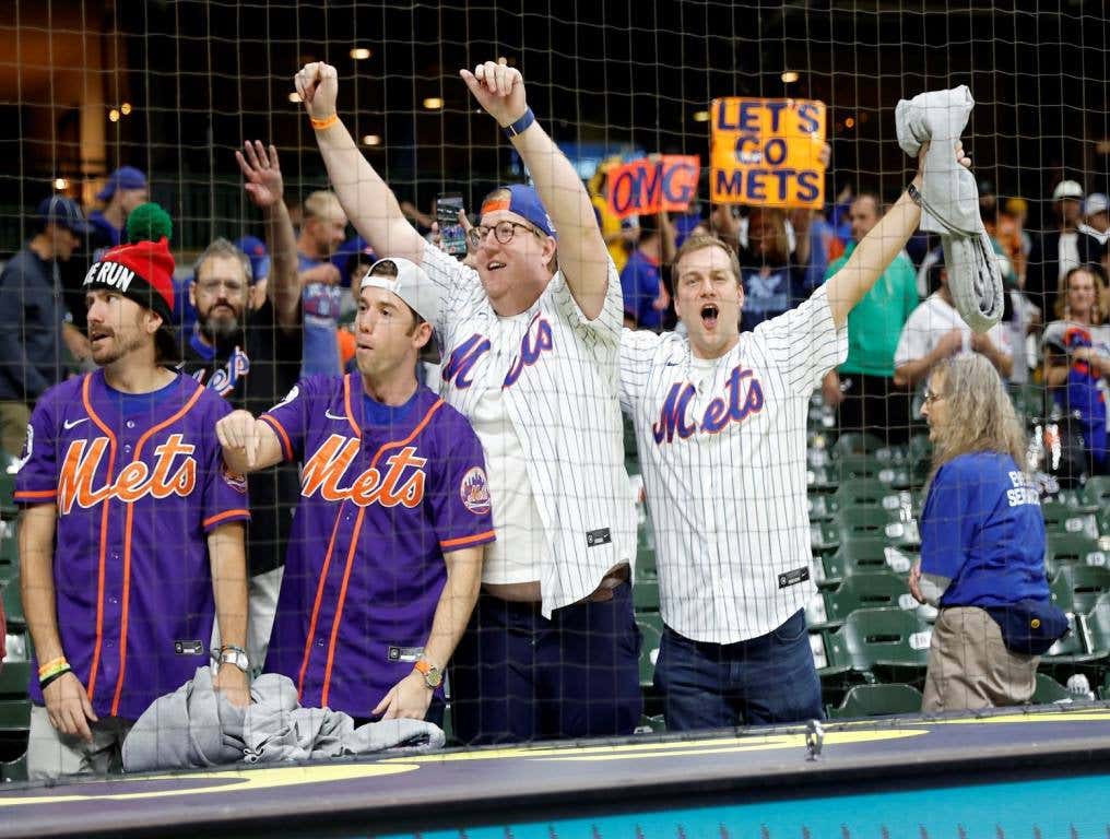 Mets fans celebrate wild card win.