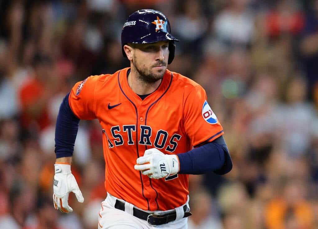 Alex Bregman watches a home run. 