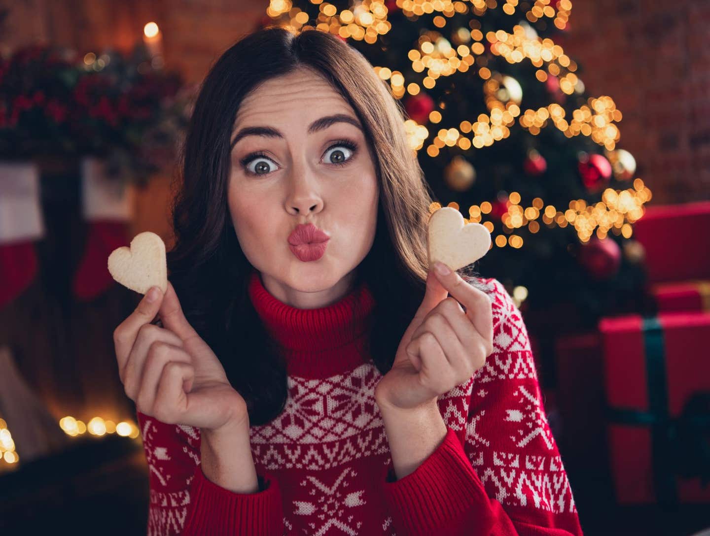 Woman with heart cookie. Pennsylvania, Delaware and New Jersey's most popular Christmas sweets and treats have been revealed