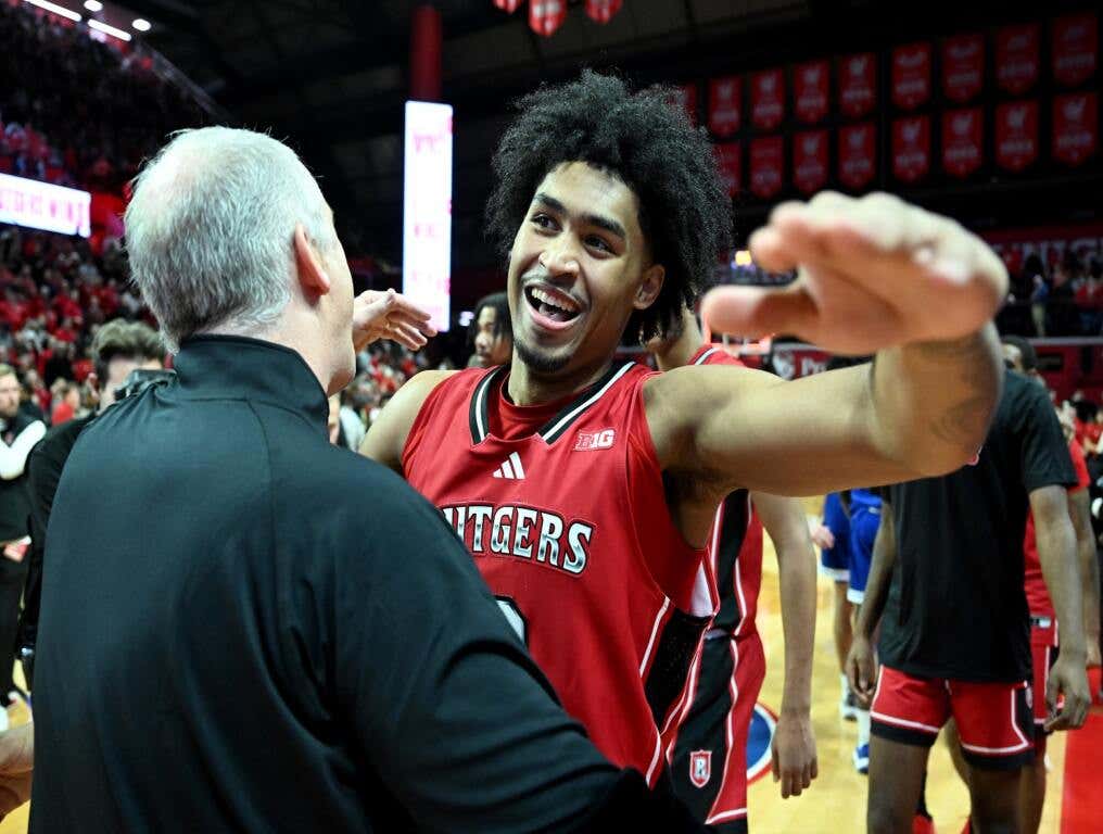 Dylan Harper hugs Steve Pikiell after a win over Seton Hall.