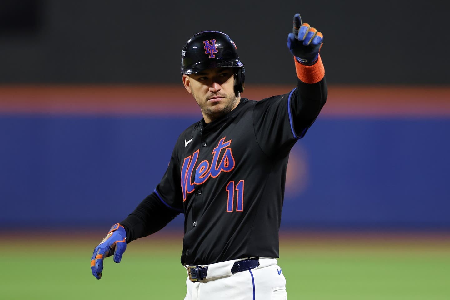 Jose Iglesias points back to the mets dugout.