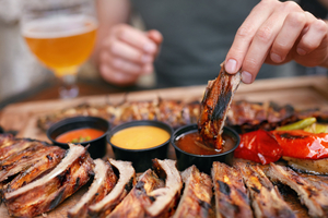 Barbecue Ribs With Sauсes Closeup