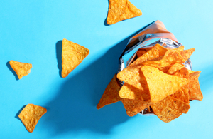 Bag chips doritos on blue background